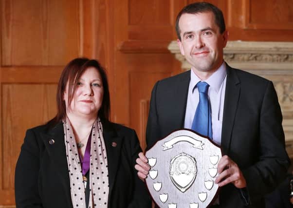 At Queen's University this week, David Hill was awarded the honour of Fellow of the Personal Finance Society and won the award for top score in Northern Ireland for the Advanced Diploma in Financial Planning. He received the award from Jayne Gibson from the Chartered Insurance Institute. INLT 25-645-CON
