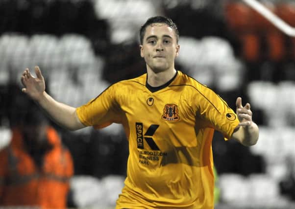 Shane Dolan celebrates after scoring for CarrickRangers against Portadown in 2012. Photo: Presseye