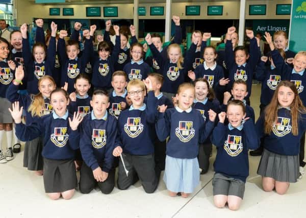 P6 pupils from Mossley Primary School, winners of the Aer Lingus Art for Schools competition 2014, pictured at Belfast City Airport before jetting off to London. INNT 26-502CON
