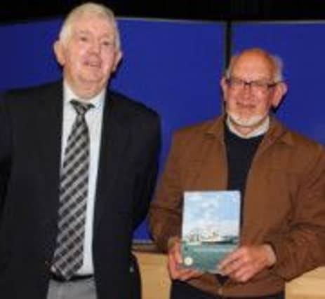 CUSHENDUN journalist Denis O'Hara is pictured with guest speaker and recently retired Moyle District Councillor Randal McDonnell at the launch of his latest book, 'Ship to Shore. Glens of Antrim Mariners', in the Cushendall Parish Centre. The 300-page narrative, a limited edition, is a unique expose into the seafaring exploits of Glens of Antrim sailors for over 200 years. There are 55 chapters of special significance, revelations of the often traumatic sea travels, the triumphs, and the tragedies.

The hardback issue, featuring 190 photographs and illustrations, highlights the necessity of olden time small farmers of the Glens having to take to work on the waves during winter months, to feed their families. Many men went to sea from the along the Antrim Coast as professional mariners, first and foremost, and the writer deals with an extensive trawl of stories from Glenarm to Torr Head. INBM26-14 KMA