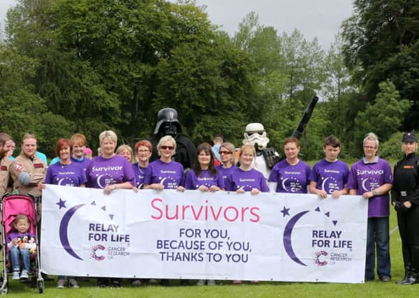 The 'Survivors' are joined by members of the Emerald Garrison as they set off on the opening lap of Saturday's Walk for Life at Eaton Park. INBT 25-110JC