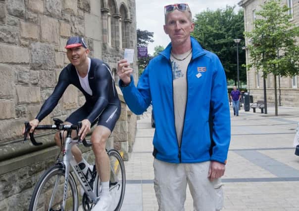 Peter Jack with his train ticket, from Derry to Belfast, and John Madden completing his warm-up, to see if he can cycle from Derry PO to Belfast PO, and arrive before Peter.
(DER-26-2406-GMI-01-CYCLE)