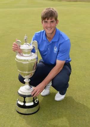Bradley Neil of Blairgowrie with the trophy after winning the final round of The Amateur Championship 2014