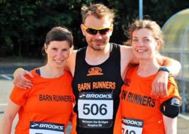 Barn Runners' Yvonne McIlree, Colin Porter and Elaine Ditty at the Between the Bridges 5K in Belfast in Sunday. INLT 26-913-CON