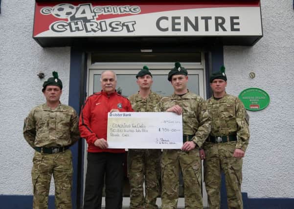 Rangers from B Company Mortars Platoon, Ballymena Army Reserve Centre ran the Belfast Marathon in aid of a local charity in Ahoghill and on Wednesday evening presented Coaching 4 Christ with a cheque for £750.Pictured are Mr Davis Weir with CSgt Brian Carthcart and other Reservists from Lowfield Camp, Ballymena Army Reserve Centre.