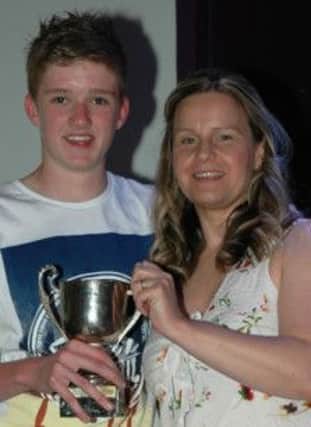 Community Cup winner Ross Johnston with the Chairperson Kirsty Pinkerton.