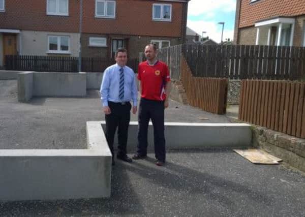 Councillor David Ramsey and Vice Chair of the Lincoln Court community association, Gary McClements, pictured highlighting the unfinished infrastructure.