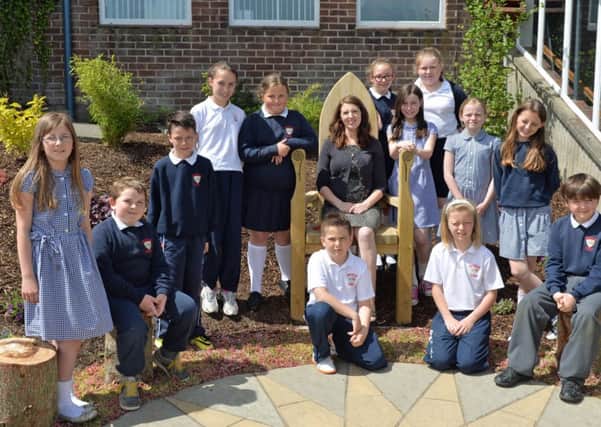 Members of the Moyle Primary School Eco Club are pictured with Mrs Barr at the official opening of their Learning Garden. INLT 26-012-PSB