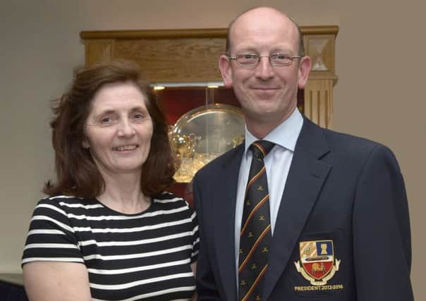 Sheree Totton is the "first lady" to hold the office of President of Banbridge Hockey Club, she is congratulated by her predecessor Neil Madeley  © Edward Byrne Photography INB1425-242EB