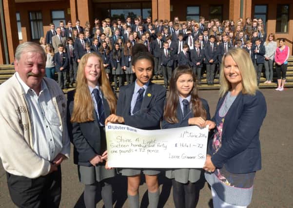Billy McCrory of "Shine A Light" is presented with a cheque for £1641.72 from Larne Grammar School Year 9. Pictured handing over the cheque are Nicole McBurney, Caitlin Ake and Nicola McAuley with Mrs Addis. INLT 25-315-PR