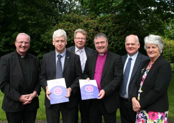 Pictured at the Irish Churches Peace Project special event held on Friday, June 20, at Malone House, Belfast, the theme of which was 'Our Journey in Peace Building, Stories, Reflections, Conversations are, from left:  Bishop Donal McKeown, ICPP chairman; Keith Hamilton  ICPP director; Rt Revd Dr Michael Barry, Presbyterian Moderator; Bishop John McDowell, Church of Ireland Bishop of Clogher;  Revd Dr Donald Watts, Irish Council of Churches president and Mrs Joan Doherty, vice-chairwoman of the ICPP, Methodist Church.  They are pictured with the ICPP Annual Report (2013).  An ICPP event will also  in the north west today, Wednesday.  Photo: Paul Harron
