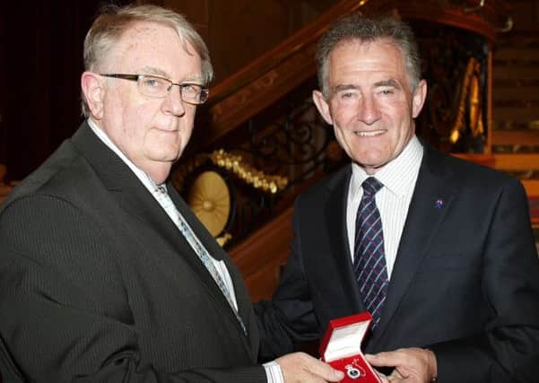 Bill Clarke from the Lisburn and Hillsborough Branch of the RNLI who receives a silver medal