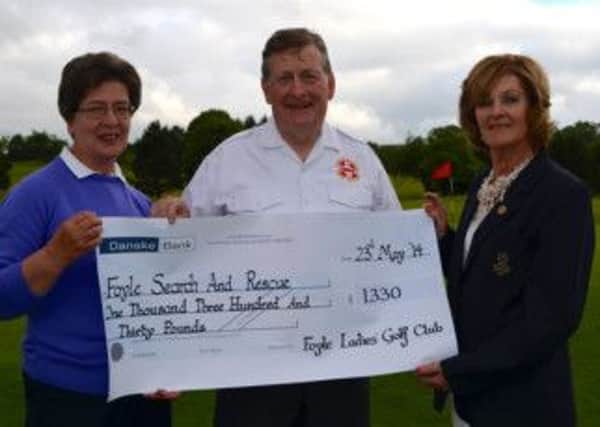 Foyle Lady Captain Denise Callan and Hon. Secretary Mya Gough presenting Danny Kelly from Foyle Search & Rescue with a cheque for £1,330.00 following the Clubs Charity Open.
