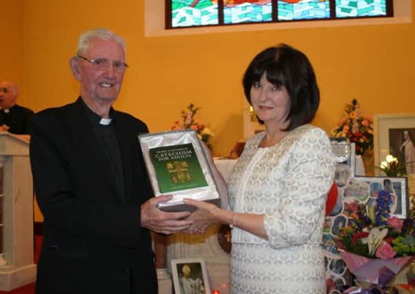 St John's PS Kingsisland teacher  Angela Quinn with Rev Fr Kieran Mac Keone PE, AP, at a Mass to mark her retirement after 37 years.