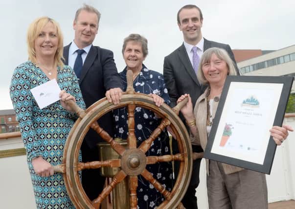 Hillsborough won Best Kept Small Town at the 2014 Ireland's Best Kept Towns awards. Pictured at the event are (L-R): Lesley Kirk, Business Operations Manager, Lisburn City Coucil, Mark Gregg, Parks & Cemeteries Manager, Lisburn City Council, Doreen Muskett, Chair of Northern Ireland Amenity Council, Mark H Durkan, Minister for the Environment and Nessa O'Callaghan, Hillsborough and District Committee.