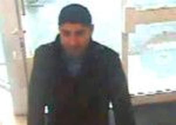 The suspect that the police would like to question about the thefts at mobile shop in Lisburn