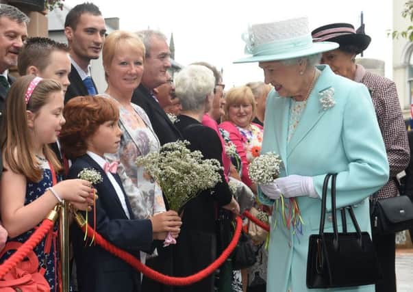 Queen Elizabeth II meeting members of the public during a wreath laying ceremony marking the centenary of the First World War at Coleraine Town Hall