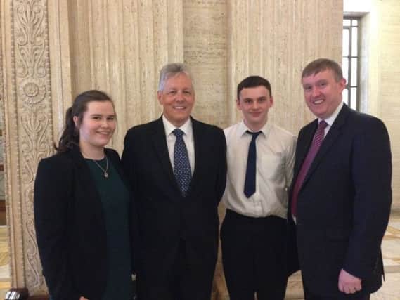 Ballycastle High School pupils Emma Orr and Danny McLaughlin chose to use their week out of school as an opportunity to explore the world of politics and government in Northern Ireland. Pictured with First Minister Peter Robinson and Cllr Mervyn Storey. INBM27-14S