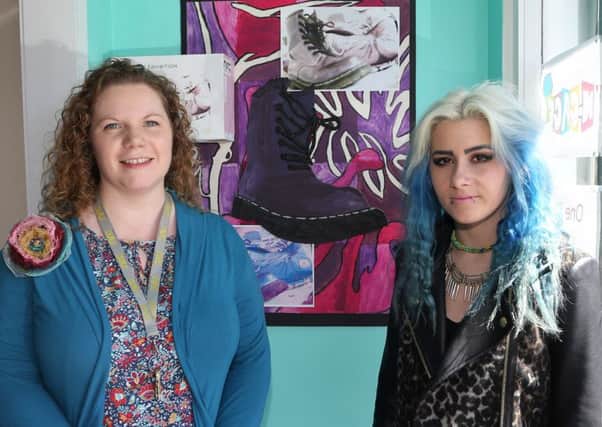 Northern Regional College C Tech Level 2 & 3 Art & Design student Laura Monteith with Art & Design lecturers Wendy Waring at last week's exhibition opening in Engage. INBT26-112JC