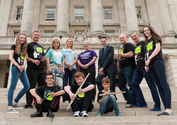 Local MLA Paul Frew pictured at Stormont with the organisers of the Big Flute Challenge and some young people taking part in the event which will take place at the Kings Hall complex on September 13.