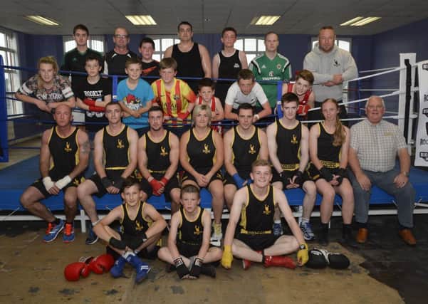 Glenn Barr, right, pictured with some of the members of Rochesters Amateur Boxing Club. INLS2614-144KM