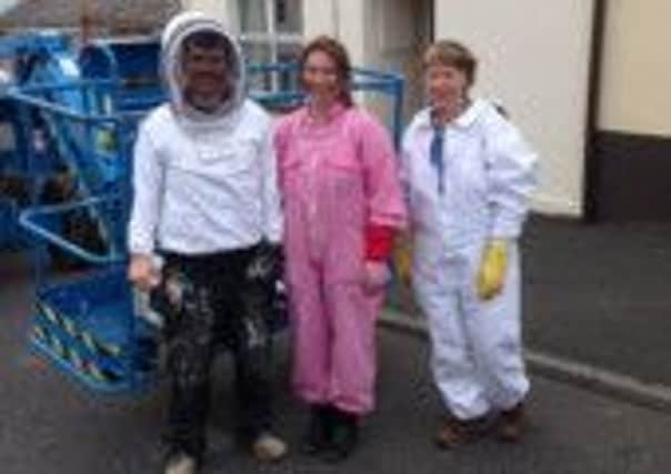 Cherry picker driver Luke along with Carol Walsh and Hazel Barr of Dromore Beekeepers Association