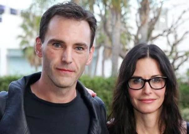 Johnny McDaid from Snow Patrol with his newly engaged actress Courteney Cox. Picture by Kelvin Boyes/Press Eye