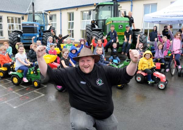 Cheers all round for the Grassmen member Gareth (Donkey) Gault when he attended theStewartstown Primary School family fun night.INMM2714-324