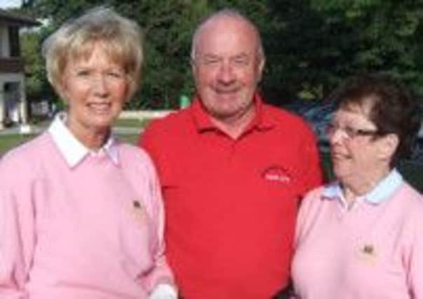 Club captain, Noel McSherry, won the Mizuno last Saturday and he is congratulated by Carole Quinn and Maeve Fee.