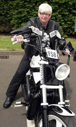 BIKER GIRL. Mandy Graham, pictured on her Harley Davidson V Rod - the only one of it's kind in Ireland - at the Mayors Show on Saturday. For the record Mandy's machine won 1st Prize in it's catergory.INBM27-14 114SC.