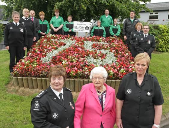 CELEBRATE. Pictured at a Flower Bed to commemorate the 75th Anniversary of St John Ambulance Ballymoney on Thursday evening are Mrs Molly Holmes, who was the 1st Superintendent and Founder member (1939),  Officer-in-Charge Ann Campbell,  President Olive Harvey and St John members.INBM27-14 065SC.