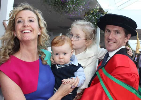 Doctor Tony McCoy with his wife Chanelle and family Archie and Eve after he wasawarded a Doctorate at UUC in Coleraine today.PICTURE MARK JAMIESON.