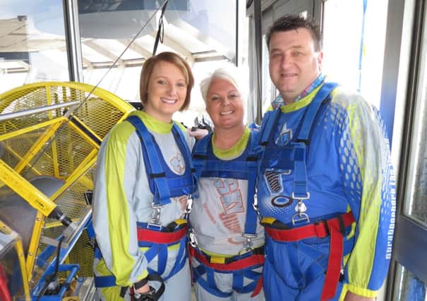 Ashley, Betty and Drew McCoubrey pictured before their 'Sky Jump' at the Stratosphere Tower in Las Vegas.  INCT 27-731-CON