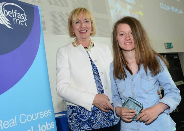 Claire Watson from Carrick was recognised for her learning success at Belfast Mets annual Apprenticeship and Training Awards. She won the Training Award (Level 1) for her achievements and progress while completing her Training for Success Routeways programme. Claire is pictured receiving her award from Marie-Thérèse McGivern, Principal and CEO of Belfast Met.  INCT 27-741-CON