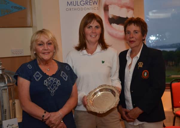 Prehen Salver winner, Naiomh Quigg is presented with the trophy by Lady Captain Marie Clifford. On left is event sponsor, Leslie Mulgrew (Mulgrew Orthodontics).