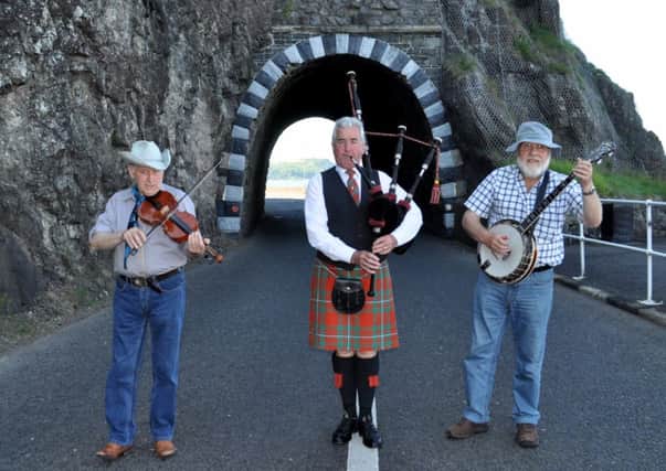 Preparing for the Cairncastle Ulster Scots Festival from July 22-August 1 are (right to left): Bluegrass music expert and fiddle maker and player, Hugh Brownlow; well-known Cairncastle piper Trevor Hassin  MBE and Jimmy McKeegan, who is the banjo player with the Grouse Beaters folk band.