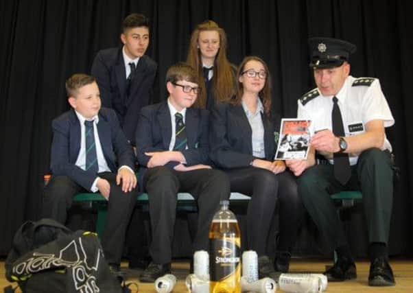 Chief Inspector Mark Robinson speaks to pupils from Fort Hill College, Kladas McClements, Kristam Junnsov, Myles Sacques, Ellie-May Dickson and Kimberley Douglas during a PSNI presentation on the dangers of binge drinking. US1426-563cd Picture: Cliff Donaldson
