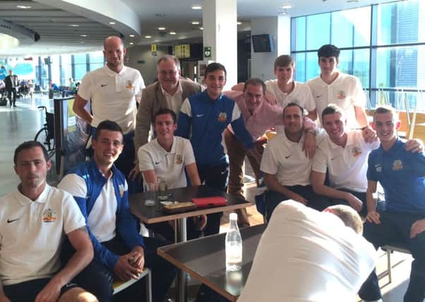 The Glenavon players waiting at the airport.