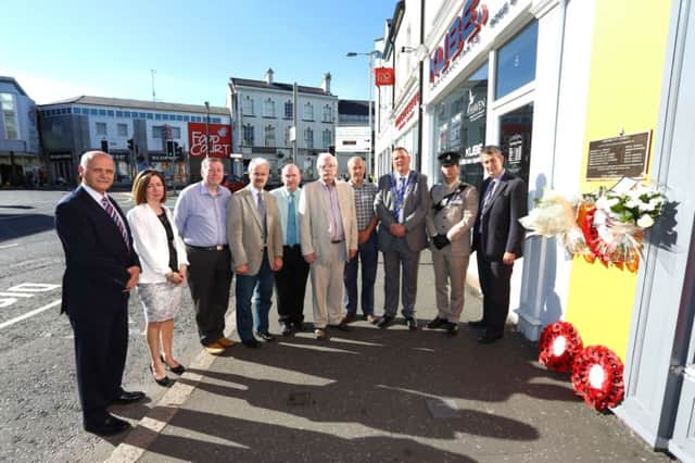 Elected representatives for Lagan Valley and Thiepval Barracks laid wreaths at the plaque in Market Place marking the site of the bomb which killed six soldiers 26 years ago.