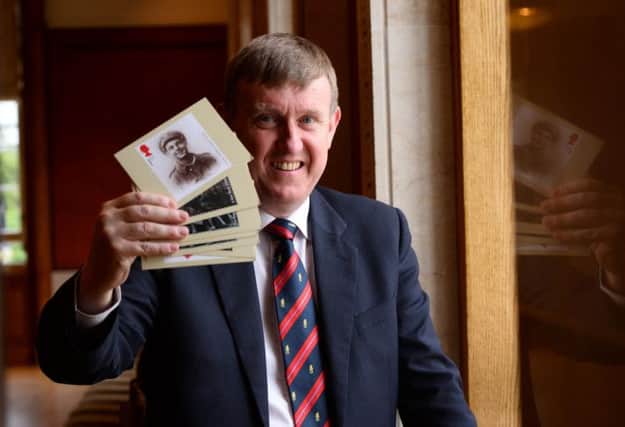 Mervyn Storey MLA runs his eye over the new stamps being issued by the Royal Mail at their launch  at Stormont buildings. INBM28-14S