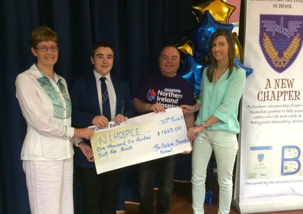 Mrs Bell, David Kerr and Mrs McKinty, from Ballyclare Secondary School, 
presenting a cheque for £1665 to John Phillips, of the Northern Ireland Hospice. INNT 28-450-CON