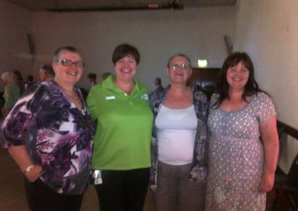 Pictured at the Women's Aid tea dance are (l-r) Christine (Volunteer at Womens Aid), Catherine (ASDA, Community Liaison), Chris (Volunteer atl Womens Aid) and Fay Tilson (Community Resettlement Worker Womens Aid ABCLN) INLT-28-701-con