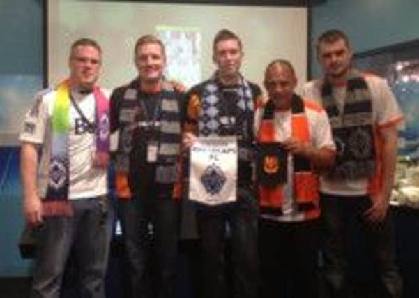 Carrick Rangers fans pictured at a recent Vancouver Whitecaps game in Canada. INLT 27-931-CON
