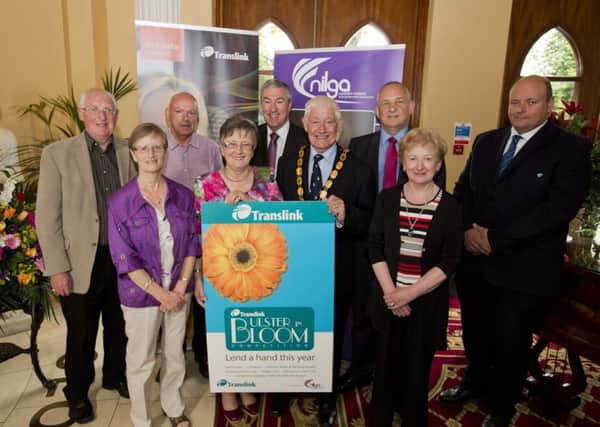 Pictured at the launch of the 2014 Translink Ulster in Bloom competition are (from left) Richard Wallace, Ballynure Ulster in Bloom; Lilly and Robert Hill, Ballyeaston Ulster in Bloom,; Cllr Evelyne Robinson MBE, NI Local Government Association vice president, Tony Depledge, Translink board member; Alderman Pat McCudden, deputy mayor of Newtownabbey Borough Council; Arthur Hamilton, Translink area manager, Isobel Wallace, Ballynure in Bloom and Roger Esdale, Translink NI Railways supervisor. INNT 28-456-CON