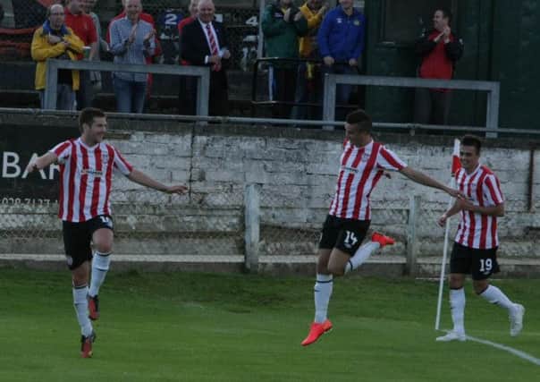 Derry City players Patrick McEleney, Michael Duffy and Mark Timlin celebrate after opening the scoring against Aberystwyth Town. DER2714MC069