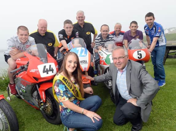 revor Kane is pictured with Miss Armoy 2013, Rachael Davis, road racers, Jamie Hamilton, Conor Behan, Paul Robinson, Billy Bamber, Sam and William Dunlop along with Chairman of the Club, William Munnis and Clerk of the Course, Bill Kennedy. INBM28-14 S
