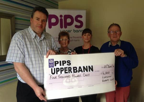 In the photograph from the left are David Finan President of Lurgan Rotary Club, Anne Nugent, Treasurer of PIPS Upper Bann, Seanna Nugent, Chair of PIPS Upper Bann and Peter Ryan, Foundation Chair of Lurgan Rotary Club