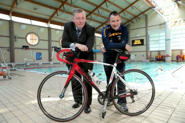 At the launch of the 2014 City of Lisburn Triathlon and Children's Aquathon are Alderman Paul Porter, Chairman of the Council's Leisure Services Committee and Kevin Madden, former triathlete.