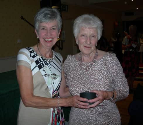 The Lady Captain, Gil Colvin with the winner of the Captain's Prize Mrs Sheila Cromie.