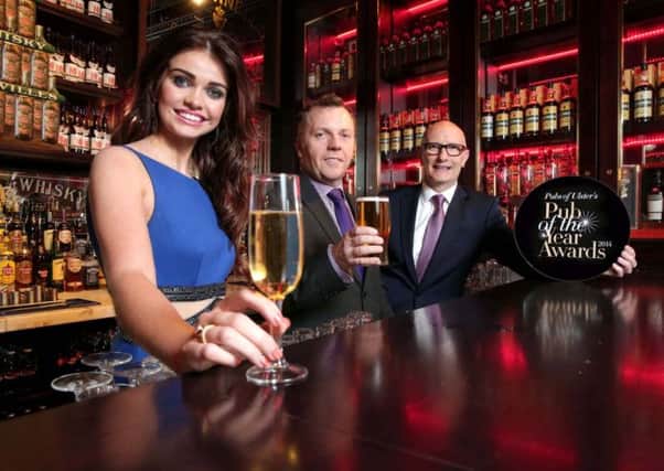 Model Anna Henry joins Pubs of Ulster chairman, Mark Stewart and CEO, Colin Neill to launch Pubs of Ulsters Pub of the Year Awards 2014.